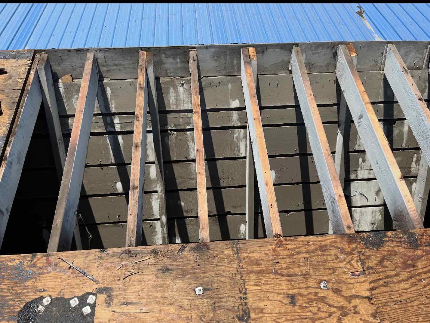 Commercial roof deck removed down to the rafters, Merced, CA